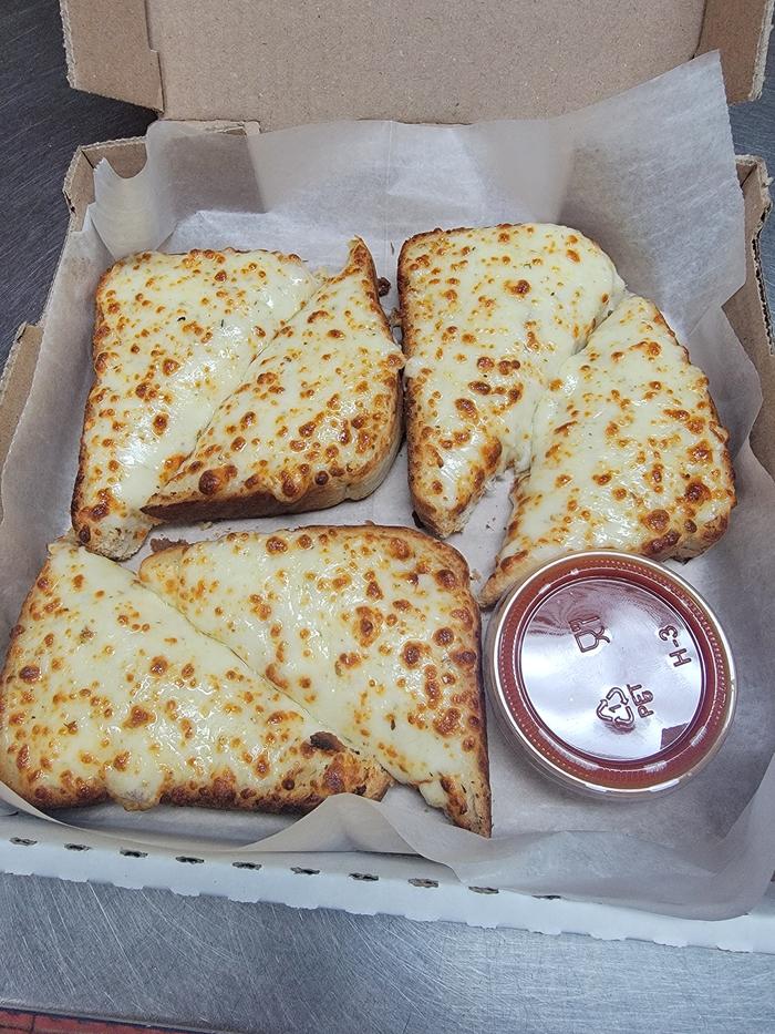 Pizza King cheese bread served with marinara dipping sauce